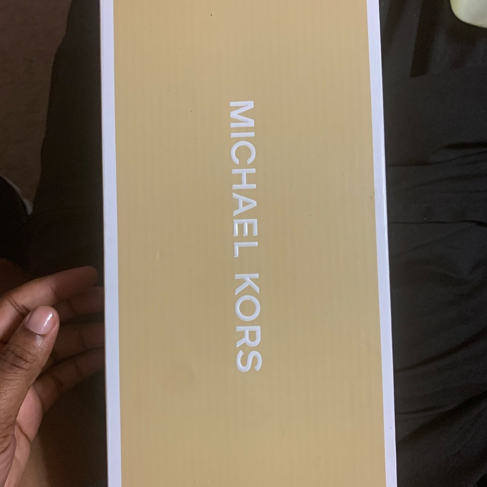 Michael Kors gold sandals.
